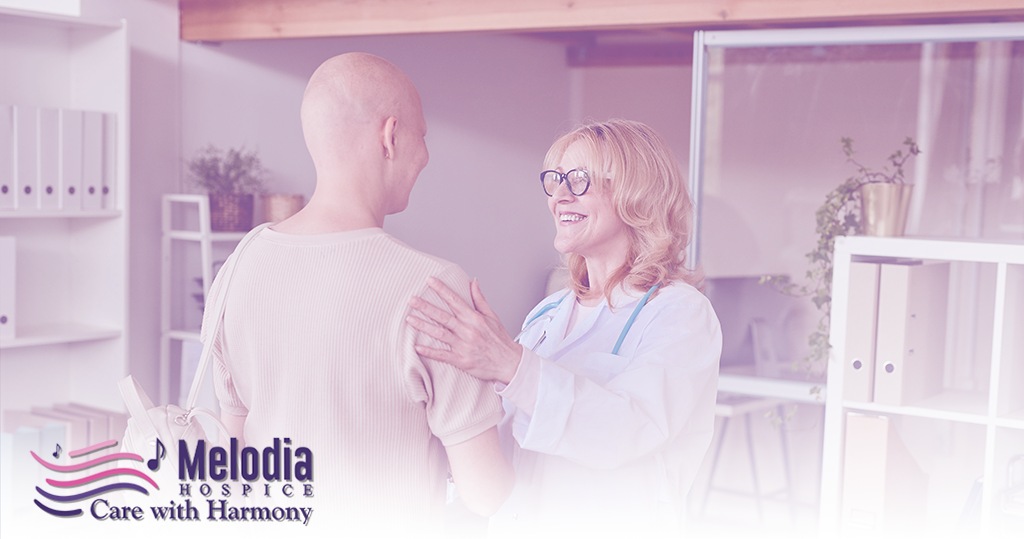 Cancer patient consulting with female doctor, illustrating the integration of palliative care into cancer treatment